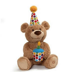 Adorable plush bear wearing a party hat and holding a colorful cake for birthday celebrations.
