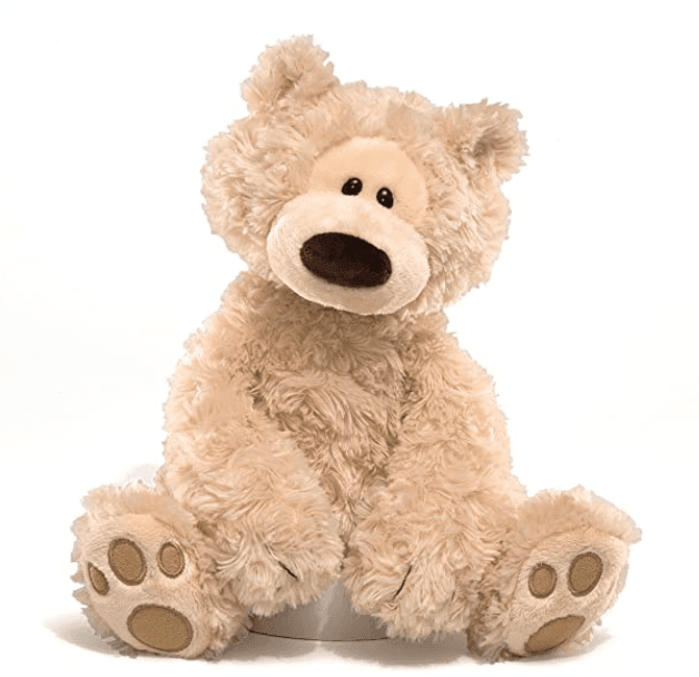 Soft, fluffy teddy bear plush toy with a warm smile, perfect for cuddles and gifts.