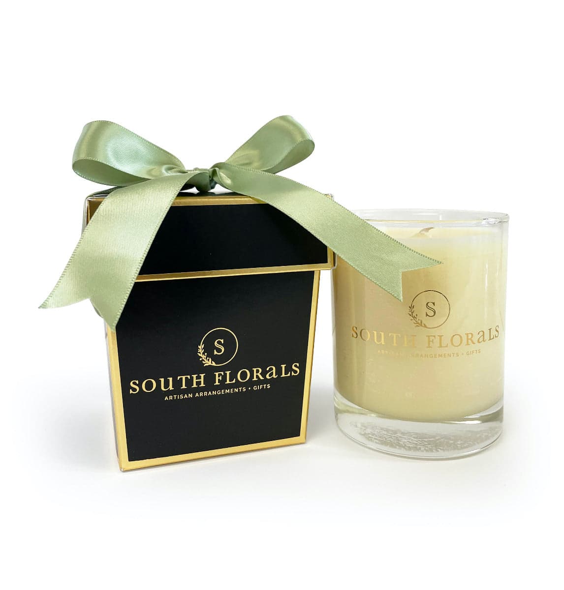 Scented candle in a stylish box with a green ribbon, perfect for gifts or home decor.