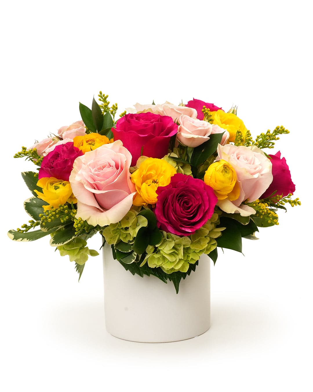 Bright floral arrangement featuring pink and yellow roses, green hydrangeas, and vibrant accent flowers in a white vase.